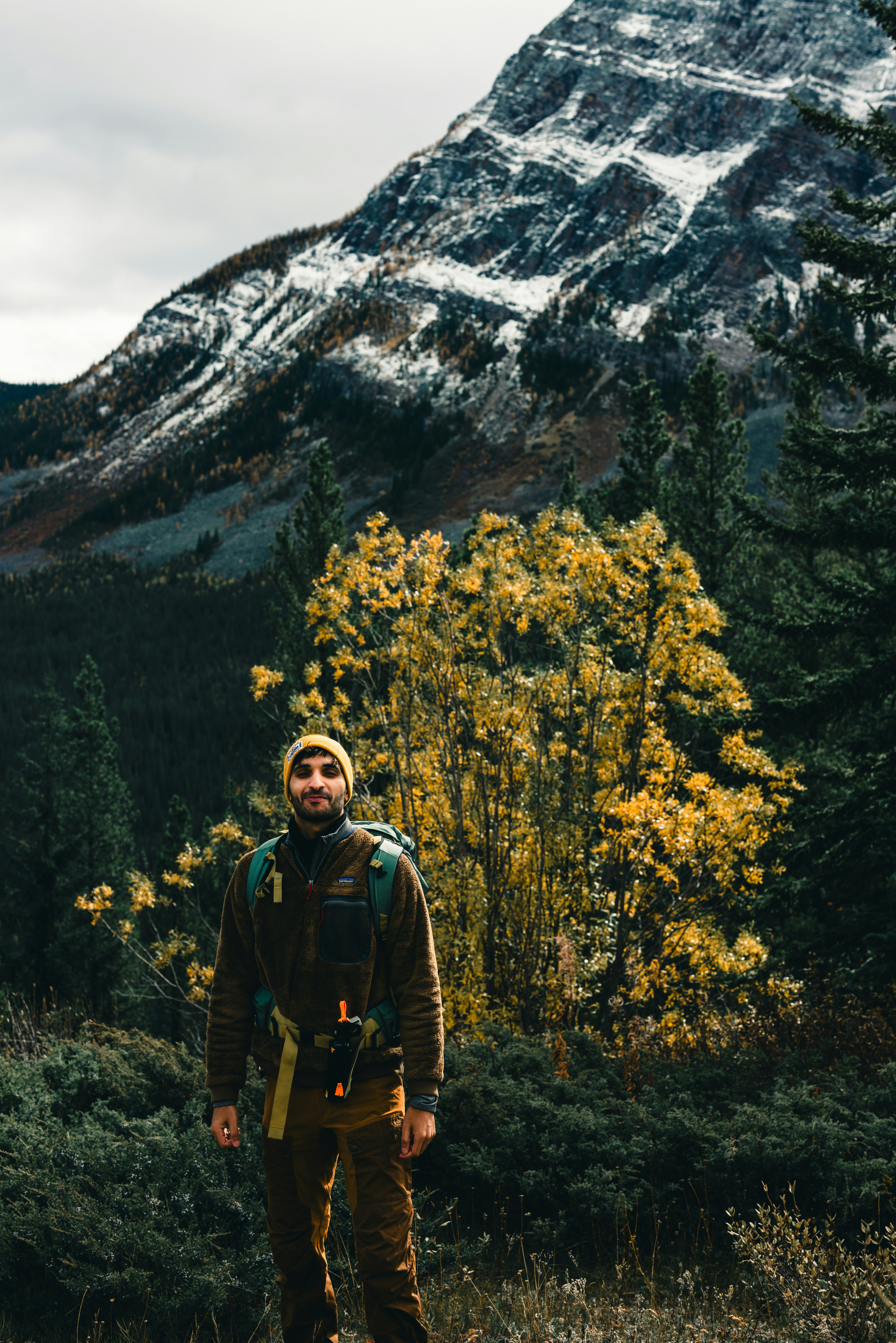 Profile photo of James Chen, verified customer in hiking gear at mountain summit